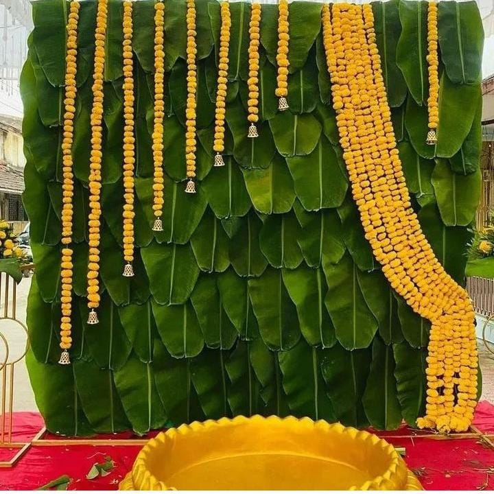 Traditional Banana Leaf & Hanging Marigolds Haldi Ceremony Setup